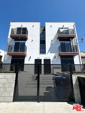 a front view of a house with a small yard