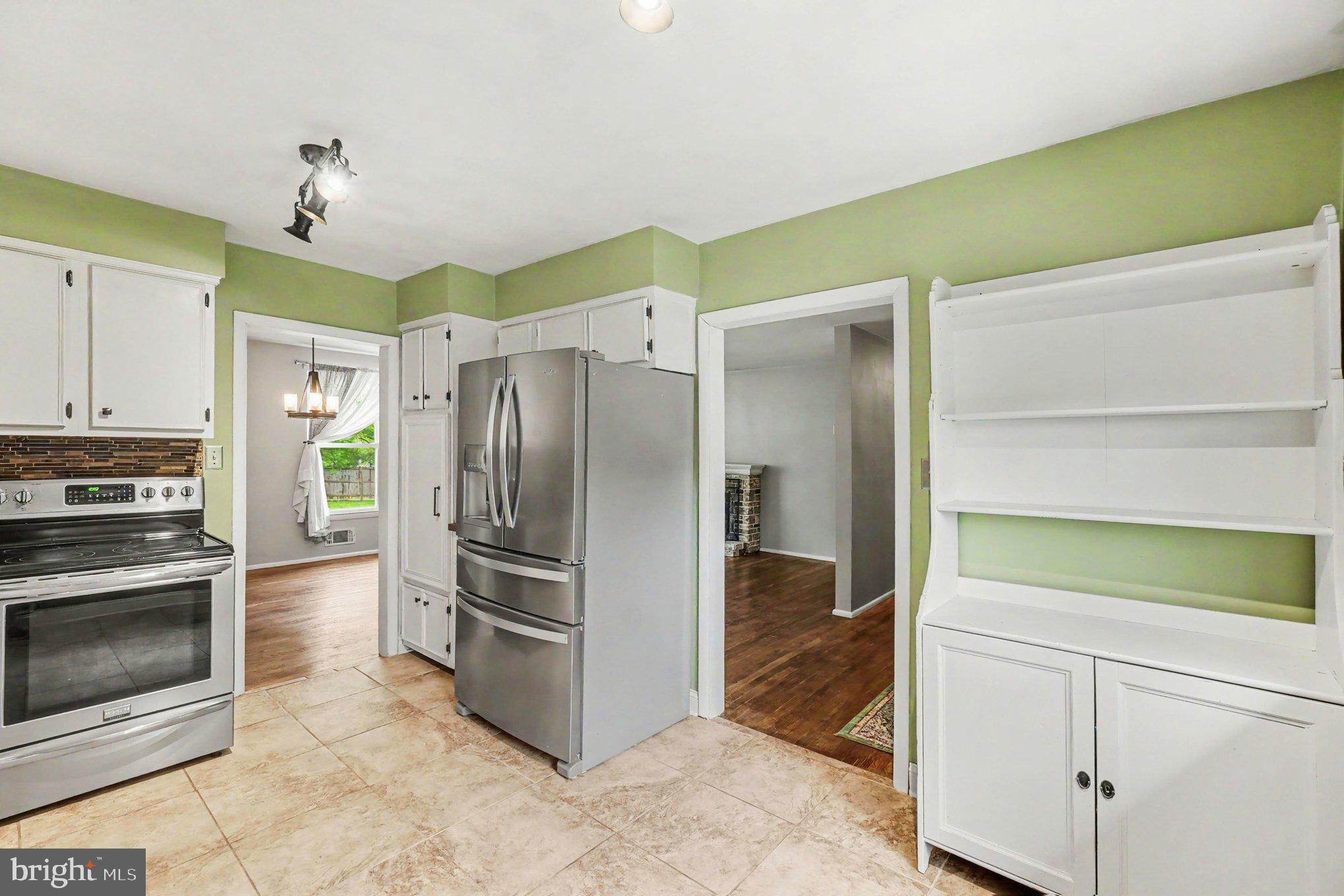 201 Mountain Road Fallston, MD 21047 - Photo 14 of 35 a kitchen with a refrigerator and a stove top oven