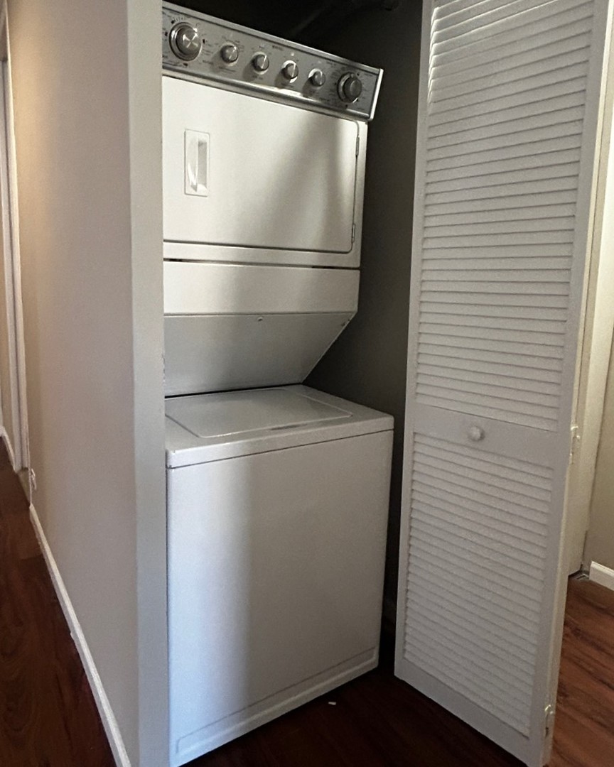 860 North Dewitt Place, Unit 1501 Chicago, IL 60611 - Photo 9 of 17 a white refrigerator freezer and a stove sitting inside of a kitchen