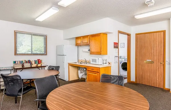 a bedroom with a bed and a table in it