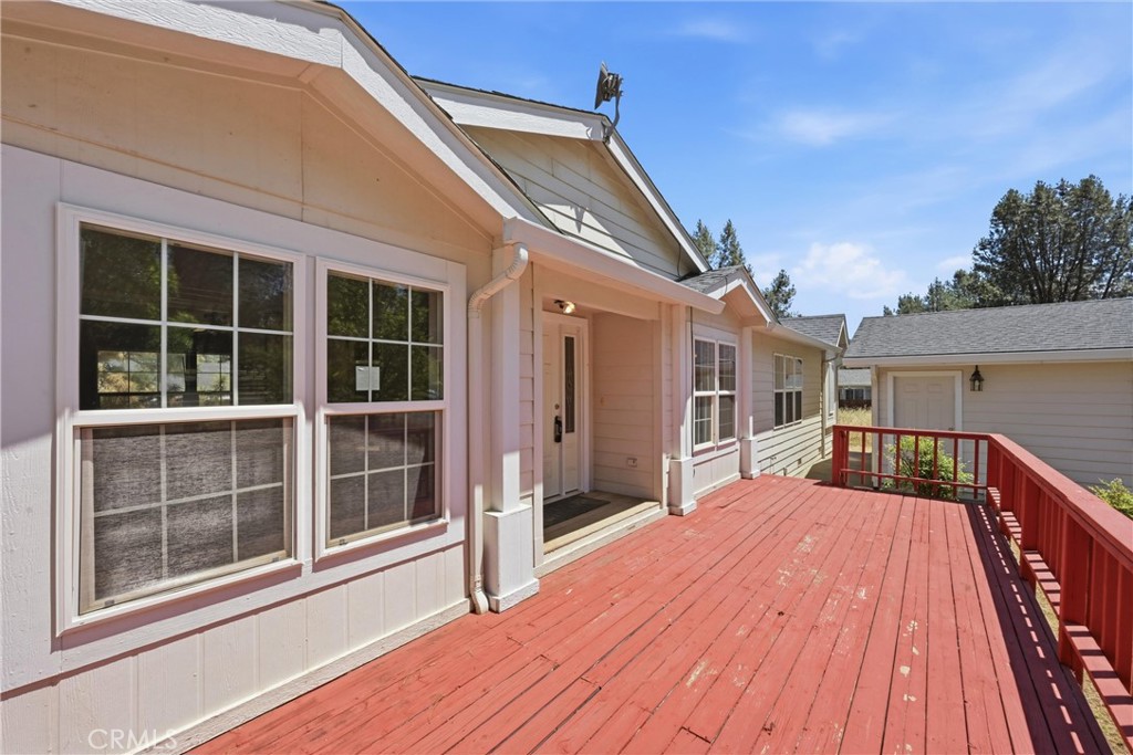 2860 Spring Valley Road Clearlake Oaks, CA 95423 - Photo 36 of 38 a view of house with a balcony and wooden floor