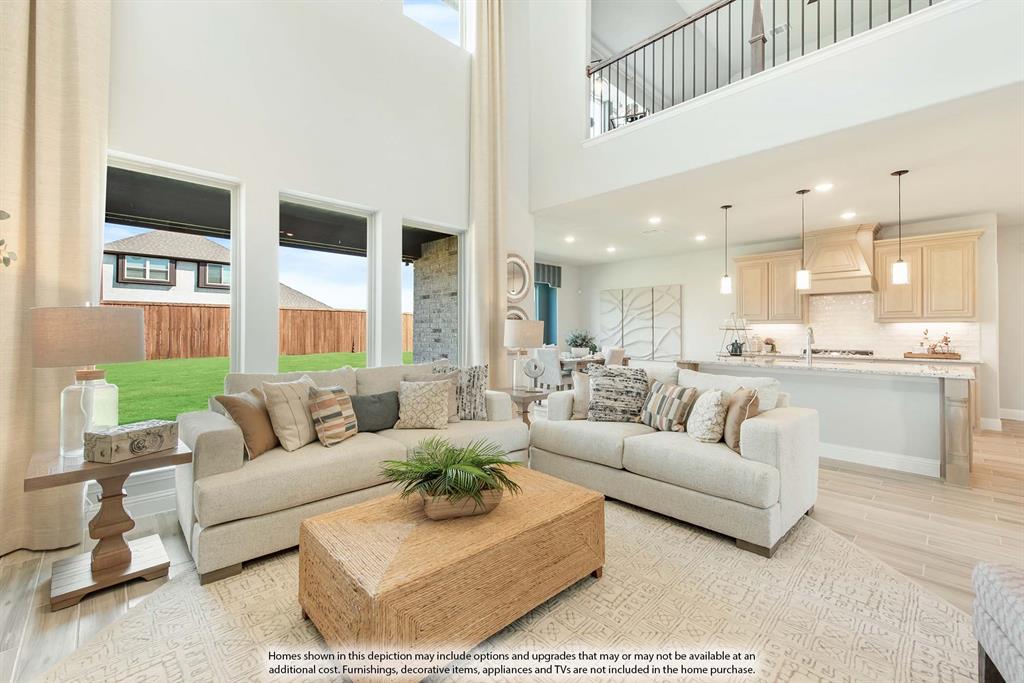 1133 Hitching Post Way Oak Point, TX 75068 - Photo 11 of 40 a living room with furniture kitchen and a chandelier