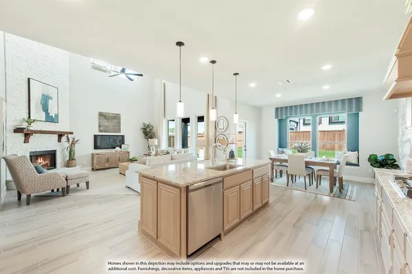 a large living room with stainless steel appliances kitchen island granite countertop furniture a fireplace and a large window