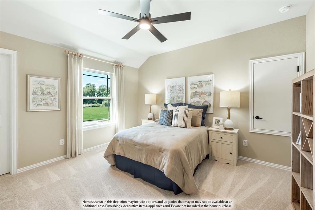 1133 Hitching Post Way Oak Point, TX 75068 - Photo 38 of 40 a bedroom with a large bed and a chandelier