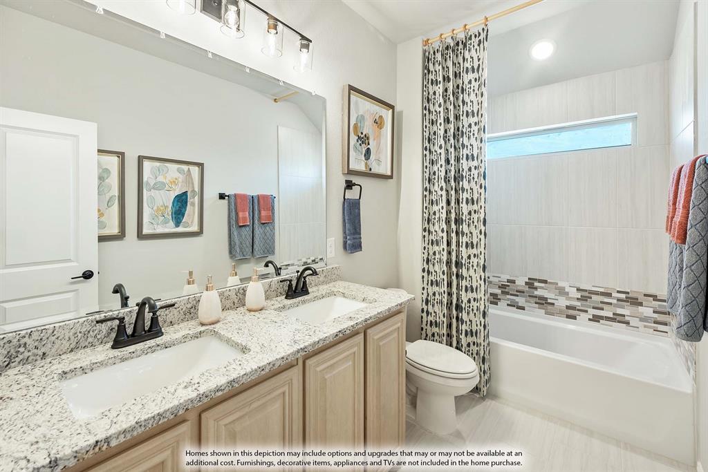 1133 Hitching Post Way Oak Point, TX 75068 - Photo 40 of 40 a bathroom with a granite countertop sink toilet mirror and shower