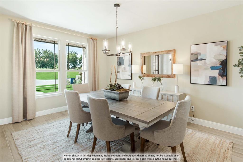 1133 Hitching Post Way Oak Point, TX 75068 - Photo 4 of 40 a view of a dining room with furniture window and wooden floor