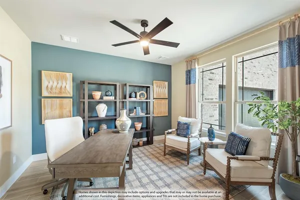 a living room with furniture a rug potted plant and a window