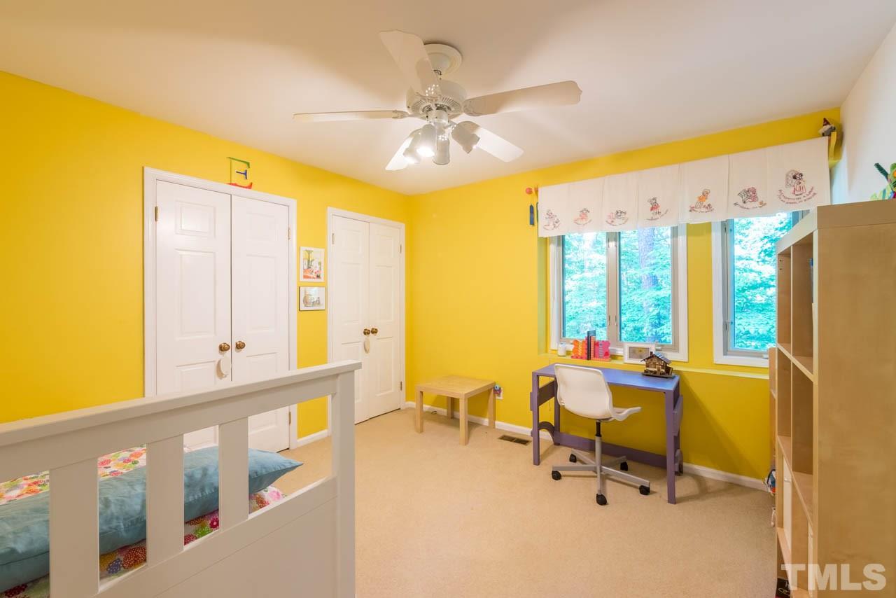 1700 Tropical Drive Raleigh, NC 27607 - Photo 11 of 25 a living room with furniture and a large window