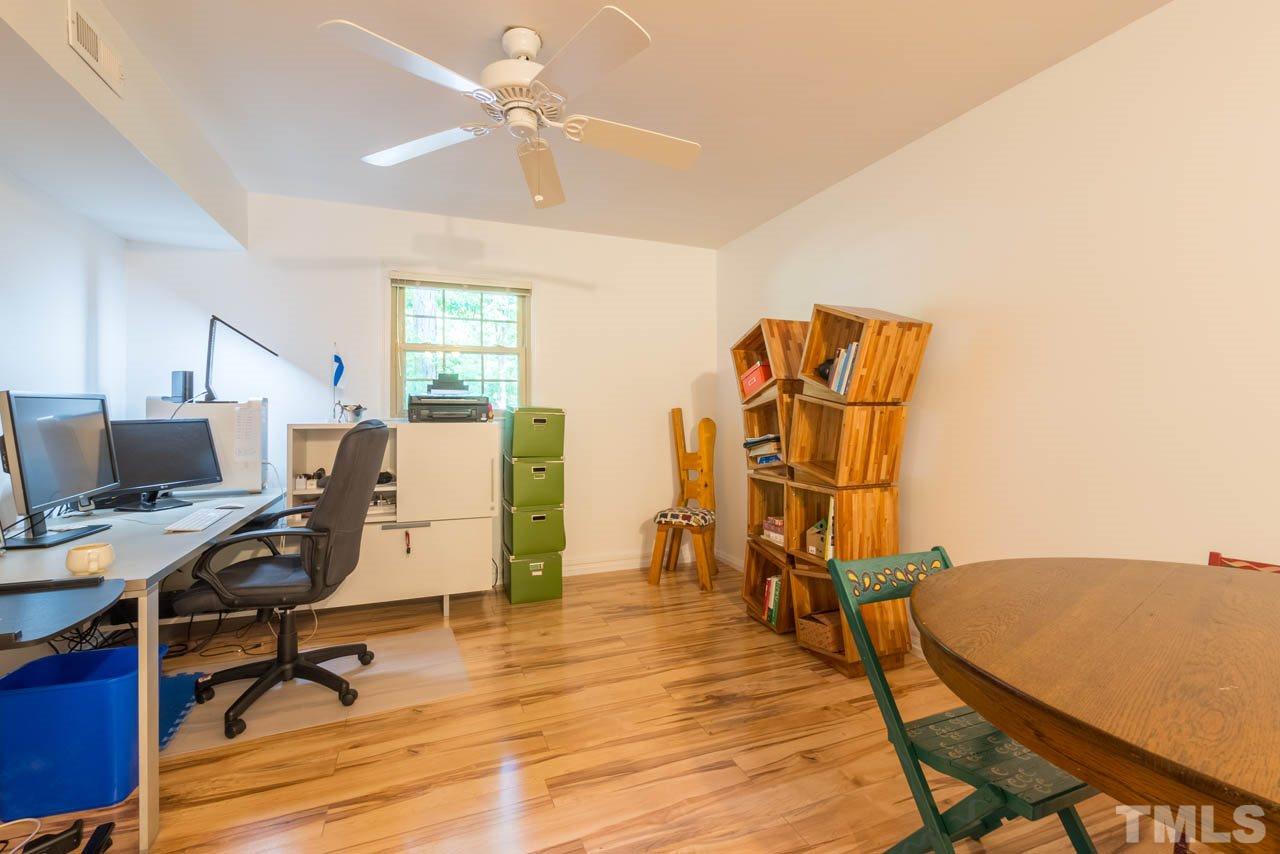 1700 Tropical Drive Raleigh, NC 27607 - Photo 18 of 25 a view of a workspace with furniture and a workspace