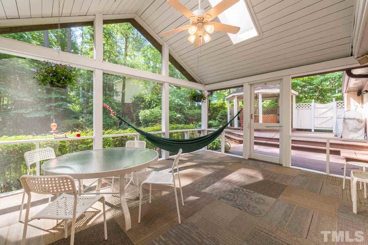 1700 Tropical Drive Raleigh, NC 27607 - Photo 21 of 25 a living room with large windows