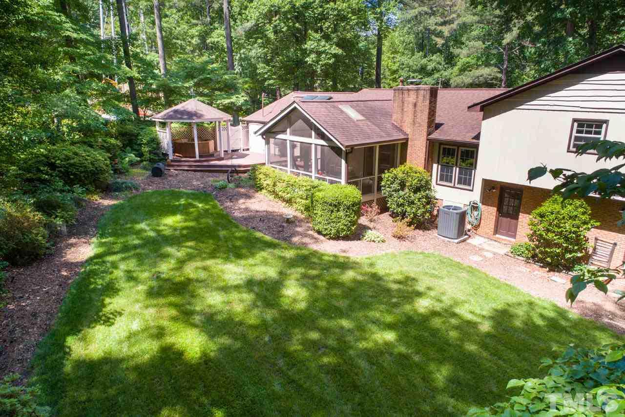1700 Tropical Drive Raleigh, NC 27607 - Photo 25 of 25 a aerial view of a house with swimming pool next to a yard