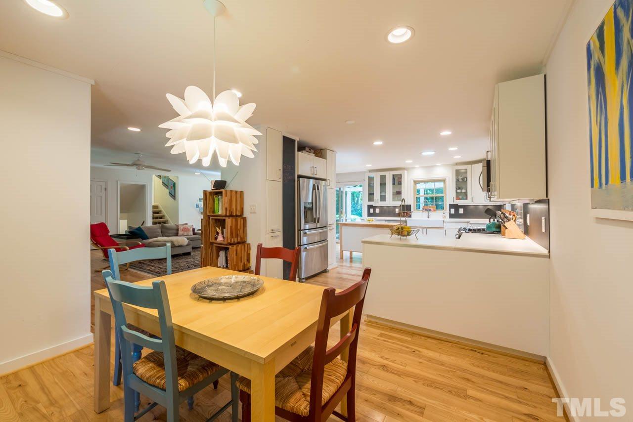1700 Tropical Drive Raleigh, NC 27607 - Photo 8 of 25 a view of a dining room with furniture and wooden floor