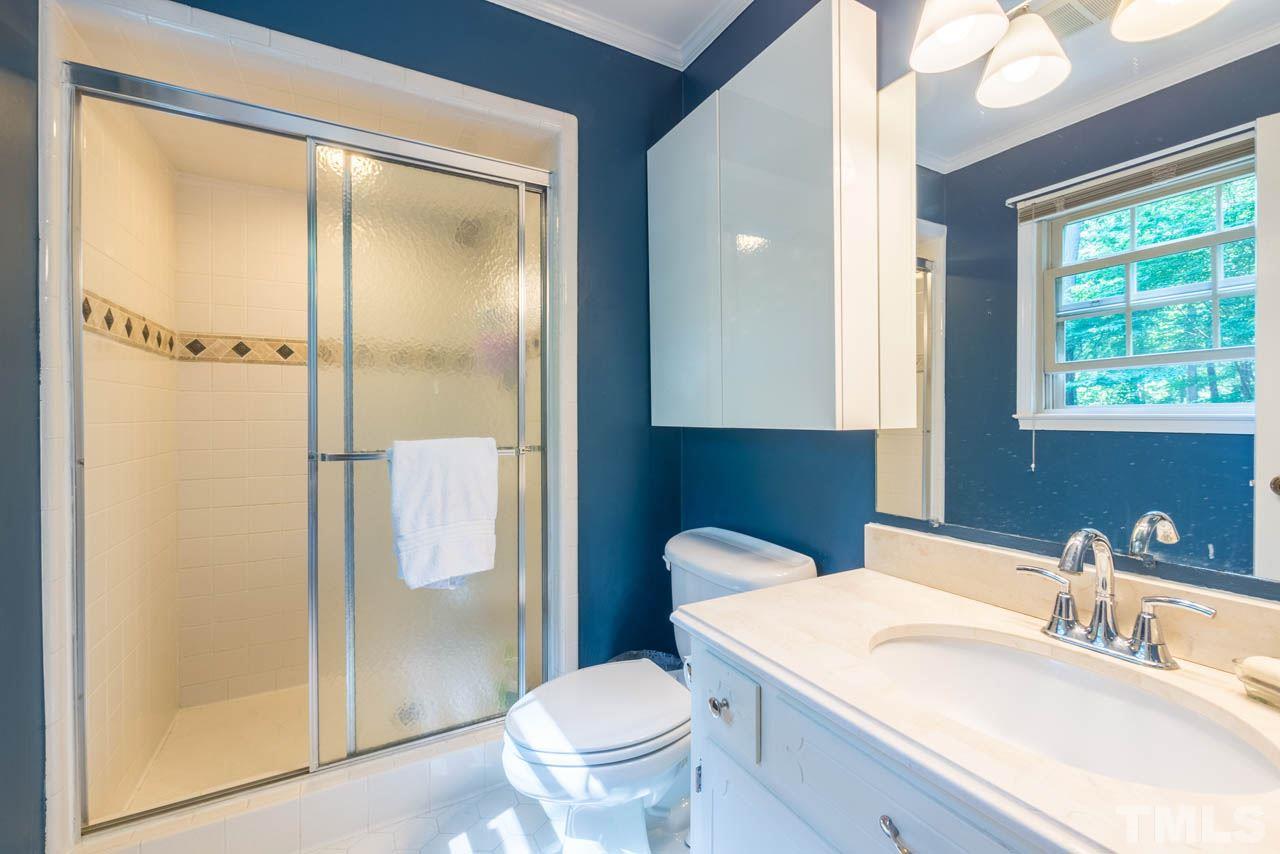 1700 Tropical Drive Raleigh, NC 27607 - Photo 10 of 25 a bathroom with a sink toilet and shower