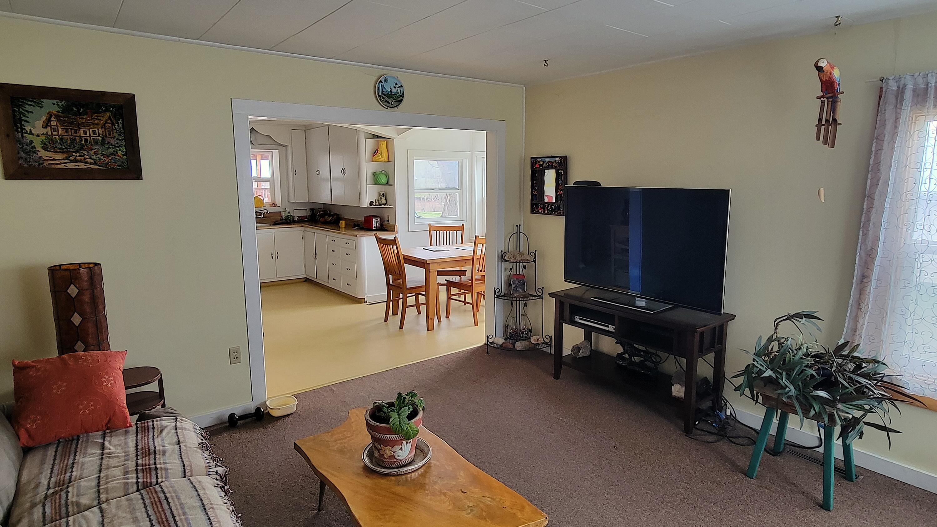 298 Main Street Monument, OR 97864 - Photo 6 of 66 a living room with furniture and a flat screen tv