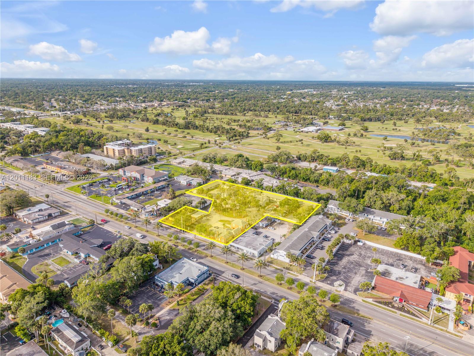 1208 South Ridgewood Avenue Daytona Beach, FL 32114 - Photo 15 of 27 an aerial view of residential houses with outdoor space