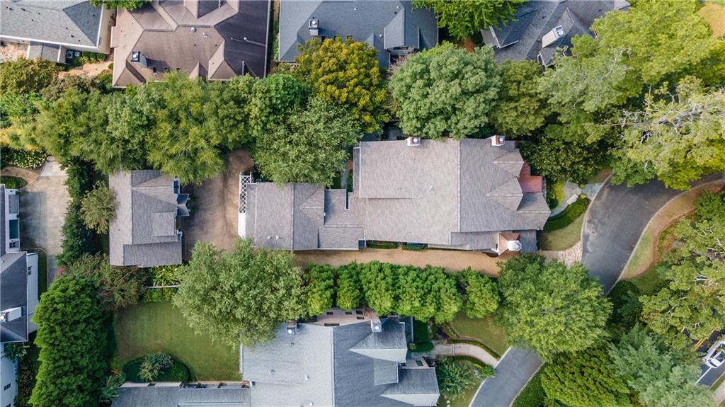 an aerial view of a house with a yard and garden