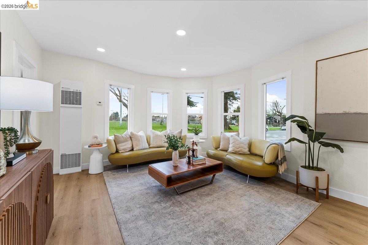 2717 Mabel Street Berkeley, CA 94702 - Photo 14 of 60 a living room with furniture and a wooden floor