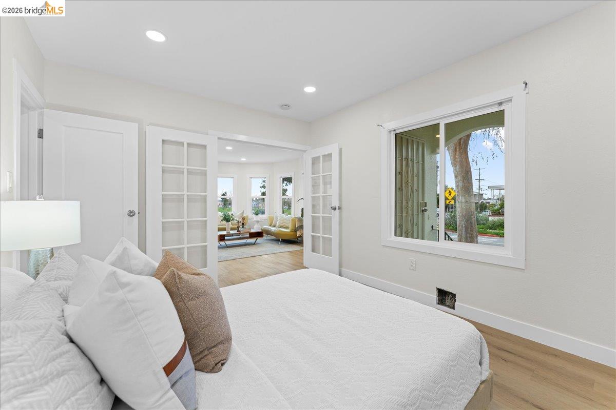 2717 Mabel Street Berkeley, CA 94702 - Photo 22 of 60 a bed room with a bed and a lamp