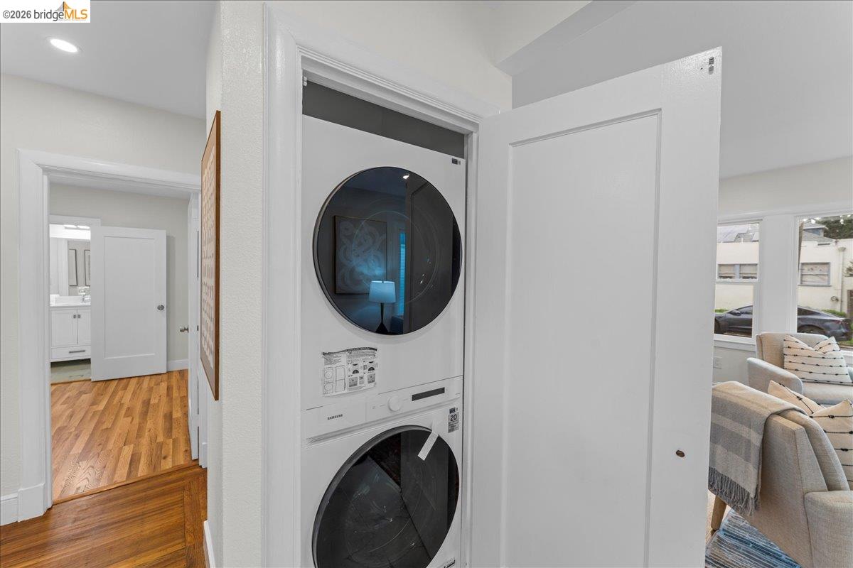 2717 Mabel Street Berkeley, CA 94702 - Photo 31 of 60 Washroom featuring stacked washing machine and dryer and wood finished floors