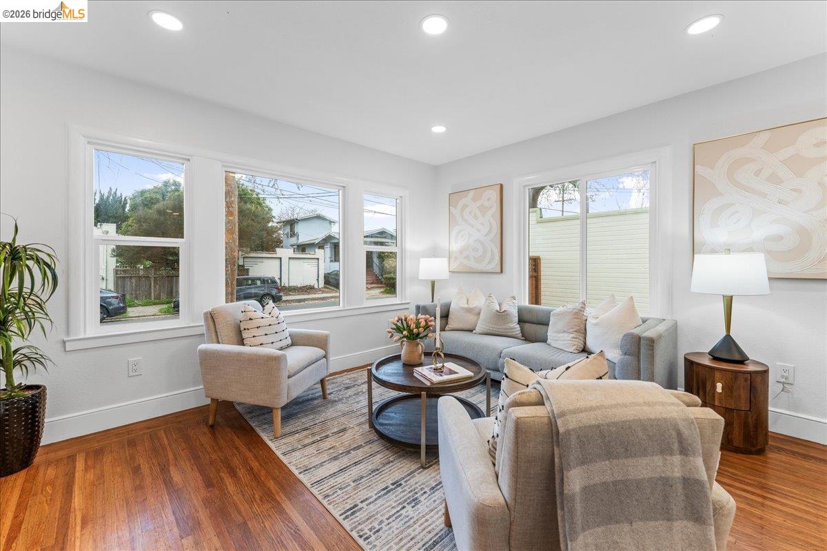 2717 Mabel Street Berkeley, CA 94702 - Photo 33 of 60 a living room with furniture and a wooden floor