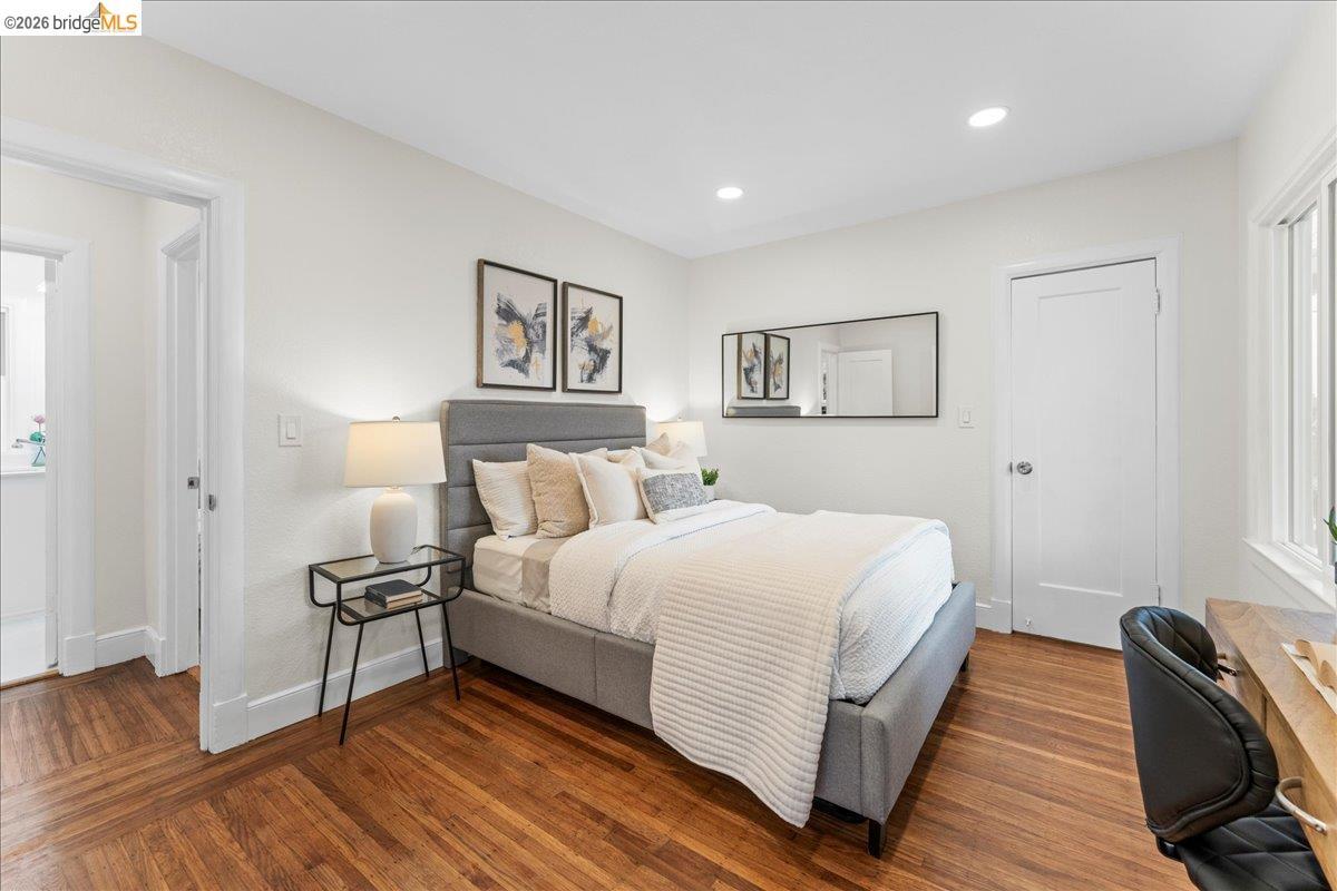 2717 Mabel Street Berkeley, CA 94702 - Photo 40 of 60 a spacious bedroom with a bed and a couch