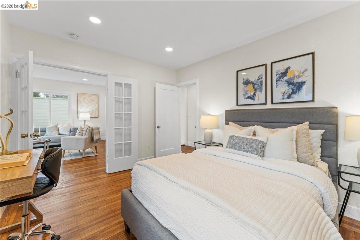 2717 Mabel Street Berkeley, CA 94702 - Photo 42 of 60 a spacious bedroom with a bed and wooden floor