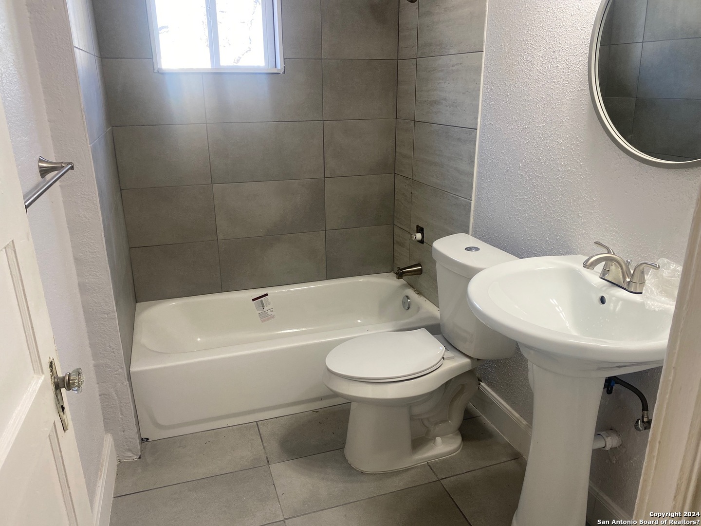 513 Walton Avenue San Antonio, TX 78225 - Photo 5 of 11 a white toilet sitting next to a bathroom sink