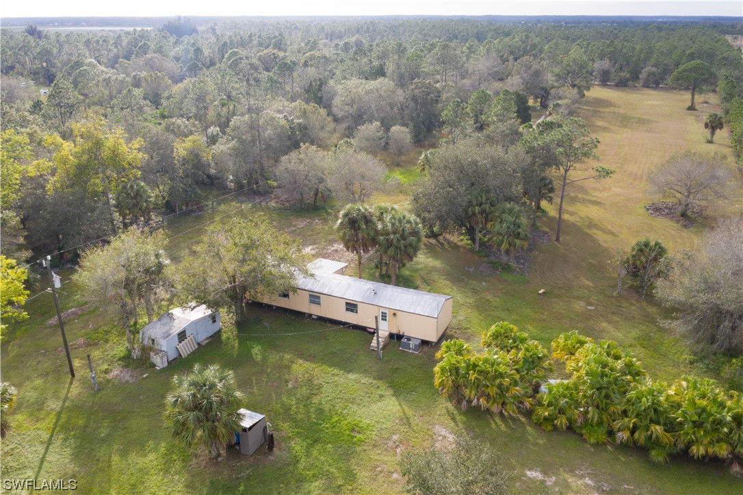 47710 Bermont Road Punta Gorda, FL 33982 - Photo 19 of 40 aerial view of a house with a yard