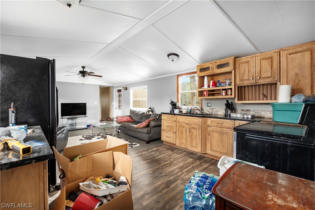 47710 Bermont Road Punta Gorda, FL 33982 - Photo 28 of 40 a living room with furniture fireplace and a flat screen tv