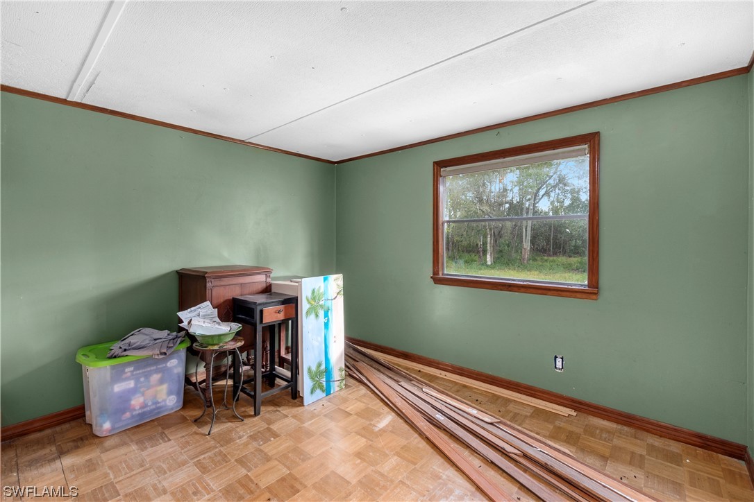 47710 Bermont Road Punta Gorda, FL 33982 - Photo 30 of 40 a view of a room with furniture and a window