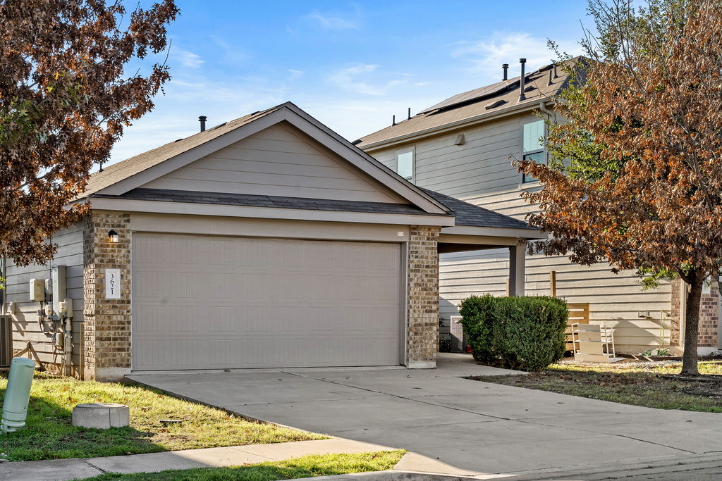 3621 Colorado High Avenue Austin, TX 78744 - Photo 1 of 40 a view of garage with a small yard