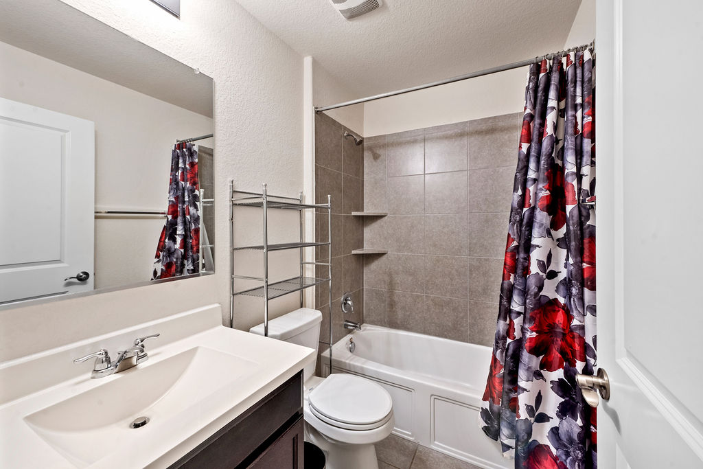 3621 Colorado High Avenue Austin, TX 78744 - Photo 21 of 40 a bathroom with a sink toilet and shower