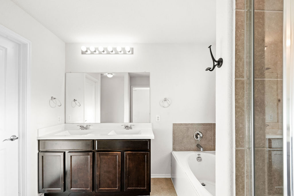 3621 Colorado High Avenue Austin, TX 78744 - Photo 27 of 40 a bathroom with a sink and a mirror