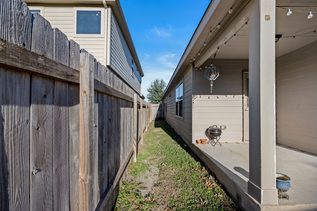3621 Colorado High Avenue Austin, TX 78744 - Photo 34 of 40 a view of a pathway of the house with wooden fence