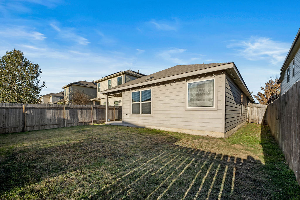3621 Colorado High Avenue Austin, TX 78744 - Photo 35 of 40 a front view of a house with a yard
