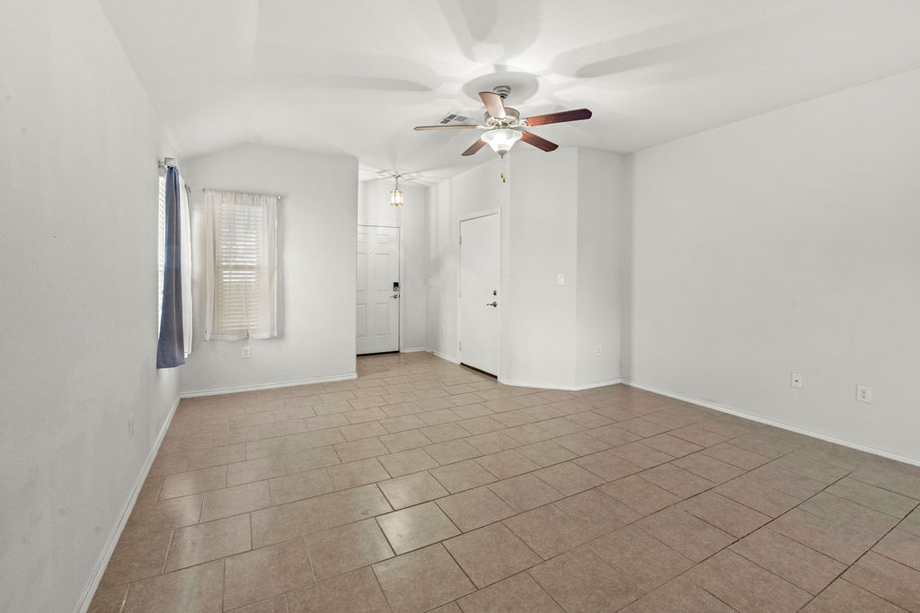 3621 Colorado High Avenue Austin, TX 78744 - Photo 6 of 40 a view of an empty room with a fan