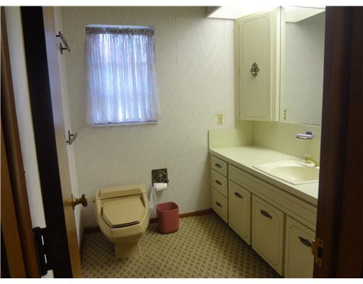 6000 Melaleuca Road Southwest Ranches, FL 33330 - Photo 16 of 19 a bathroom with a granite countertop toilet sink and mirror