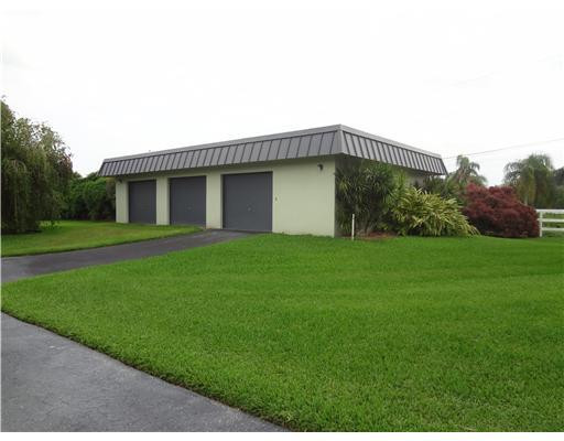 6000 Melaleuca Road Southwest Ranches, FL 33330 - Photo 3 of 19 a view of a house with a yard