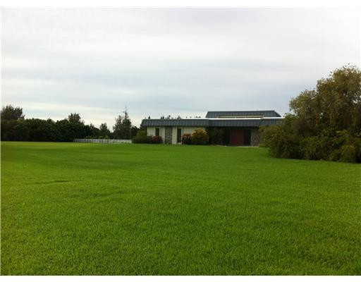 6000 Melaleuca Road Southwest Ranches, FL 33330 - Photo 4 of 19 a backyard with a garden