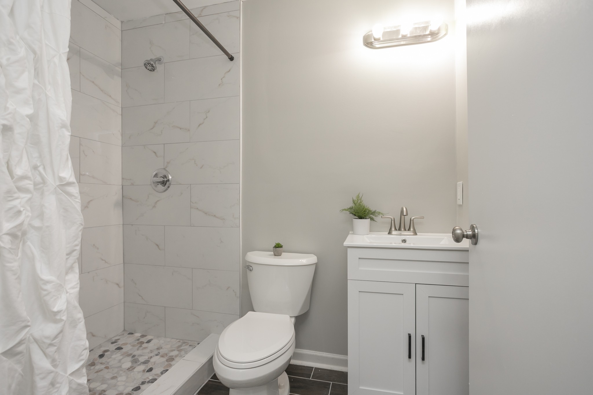 2966 Anderson Road Nashville, TN 37217 - Photo 14 of 23 a white toilet sitting next to a bathroom sink