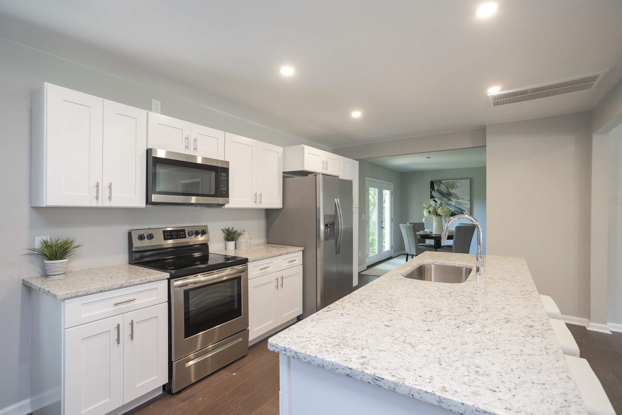 2966 Anderson Road Nashville, TN 37217 - Photo 19 of 23 a kitchen with granite countertop a sink stove and refrigerator