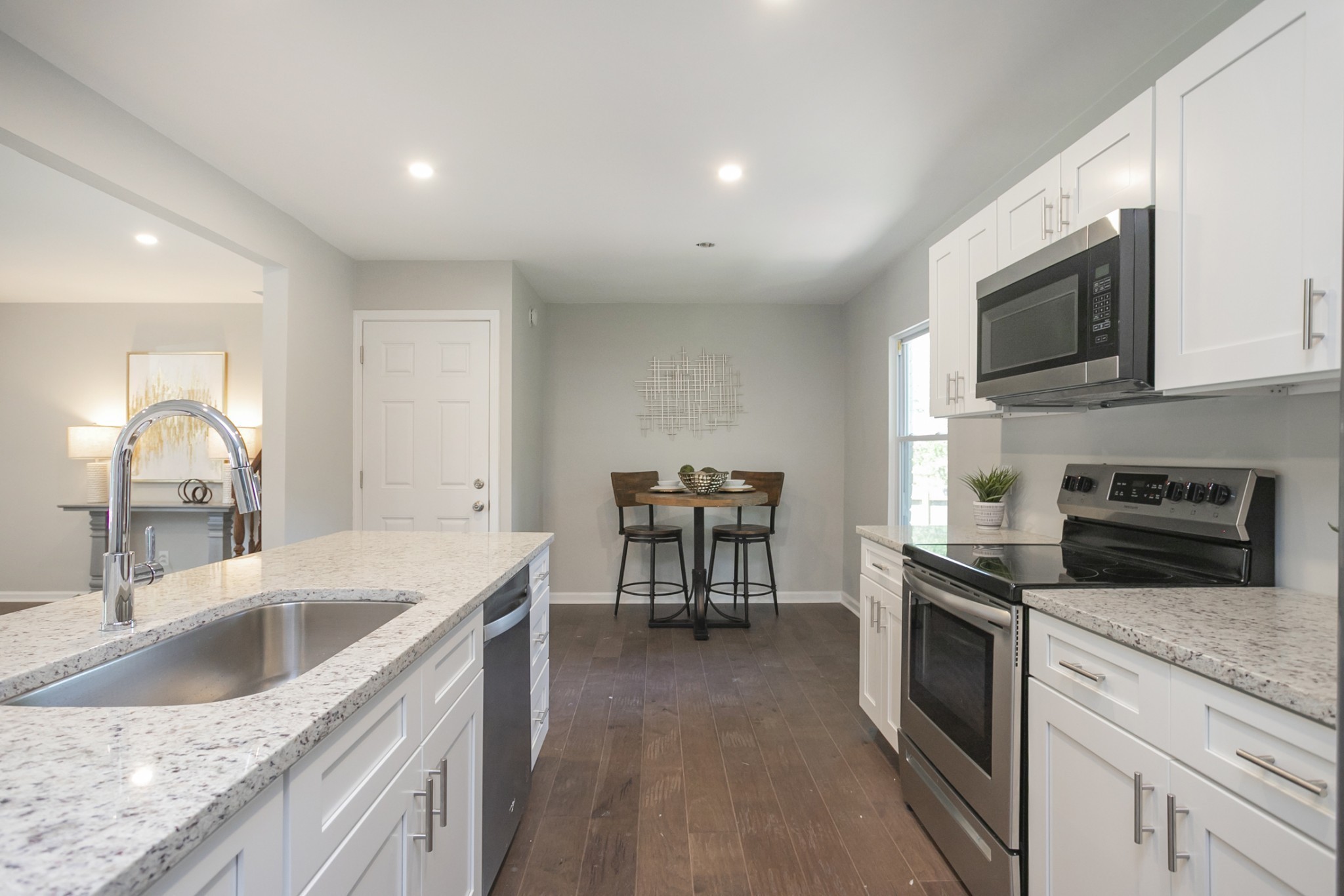 2966 Anderson Road Nashville, TN 37217 - Photo 22 of 23 a kitchen with a sink a microwave and cabinets