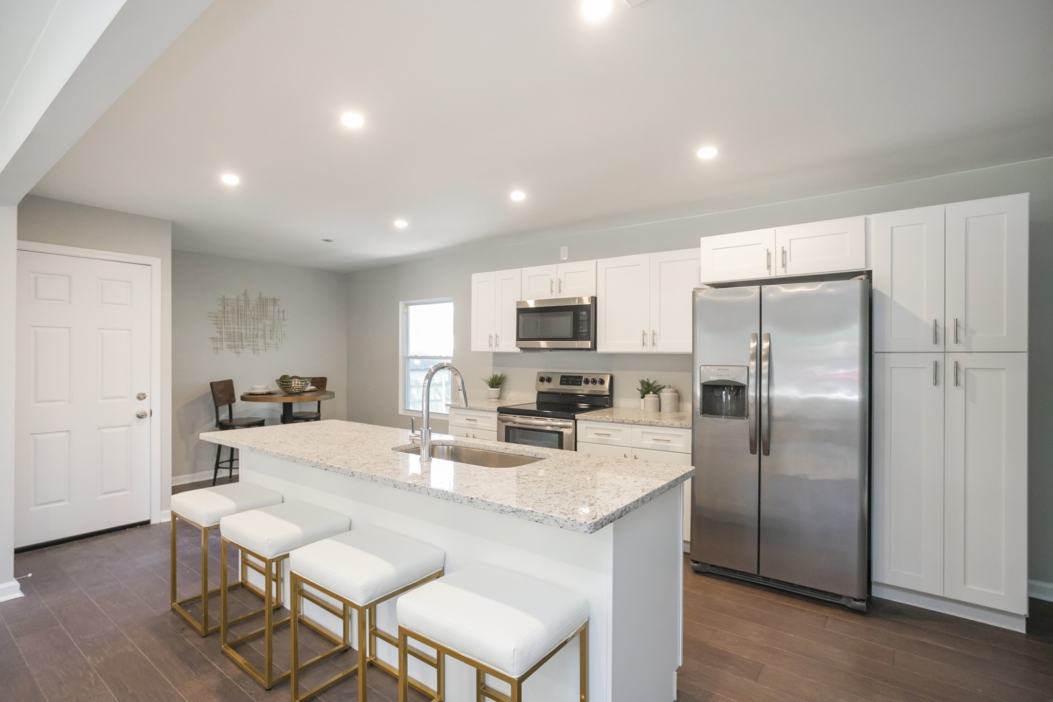 2966 Anderson Road Nashville, TN 37217 - Photo 23 of 23 a kitchen with stainless steel appliances granite countertop a refrigerator a stove a microwave oven a sink with island and chairs