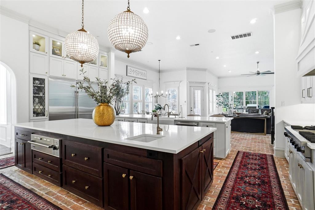 509 King Ranch Road Southlake, TX 76092 - Photo 13 of 40 a kitchen with stainless steel appliances a sink a counter space and a window