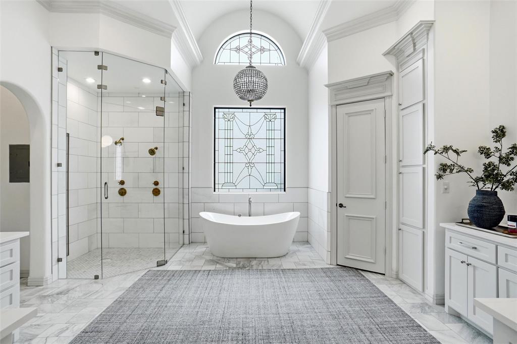 509 King Ranch Road Southlake, TX 76092 - Photo 20 of 40 a bathroom with a bathtub shower sink and mirror