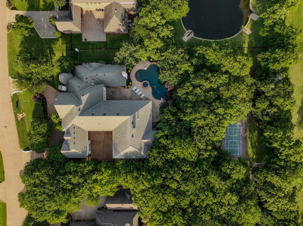 509 King Ranch Road Southlake, TX 76092 - Photo 2 of 40 an aerial view of a house with a yard and lake view