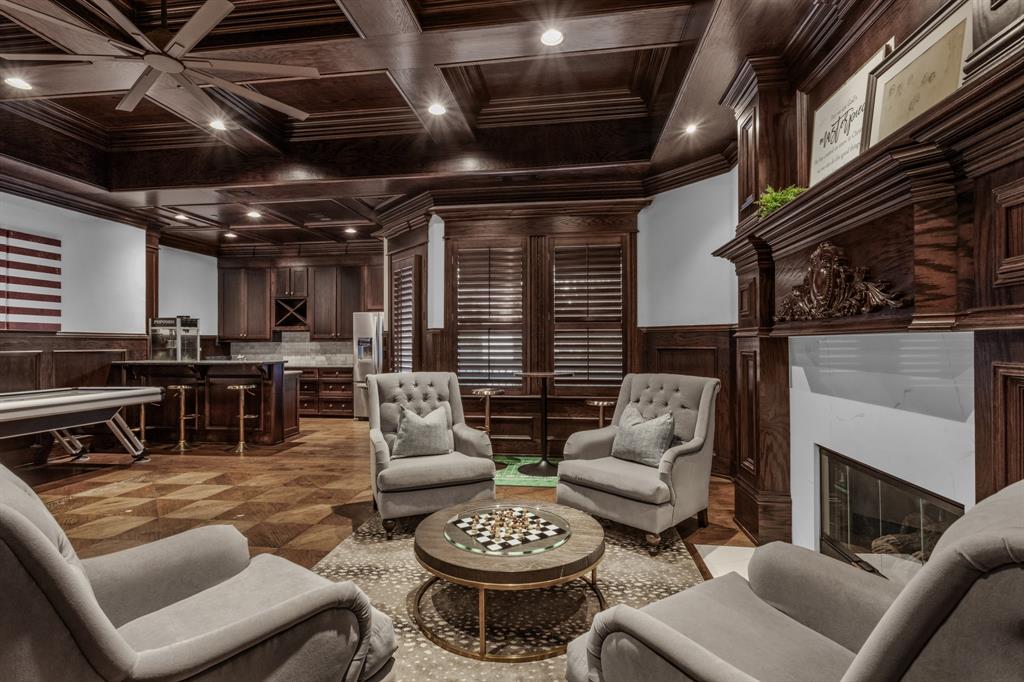 509 King Ranch Road Southlake, TX 76092 - Photo 29 of 40 a living room with furniture a fireplace and kitchen view