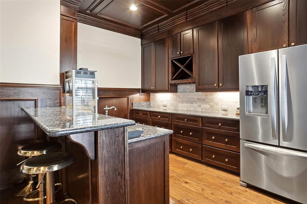 509 King Ranch Road Southlake, TX 76092 - Photo 30 of 40 a kitchen with stainless steel appliances granite countertop a sink stove and refrigerator