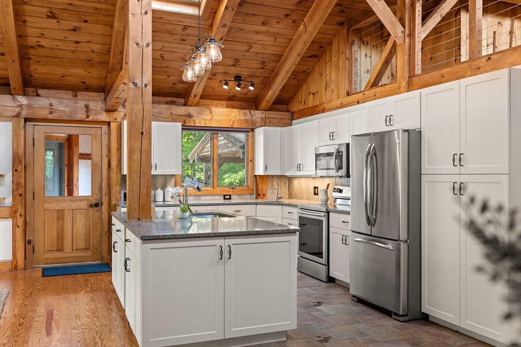 3 Whitman Place Beverly, MA 01915 - Photo 2 of 34 a kitchen with refrigerator and cabinets