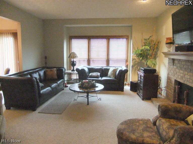 3795 Stonebridge Boulevard Akron, OH 44321 - Photo 10 of 24 A triple double hung window offers a great view of the backyard.